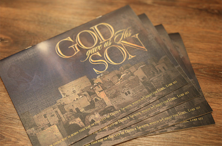 The Christmas Book small spread out stack on a wooden table